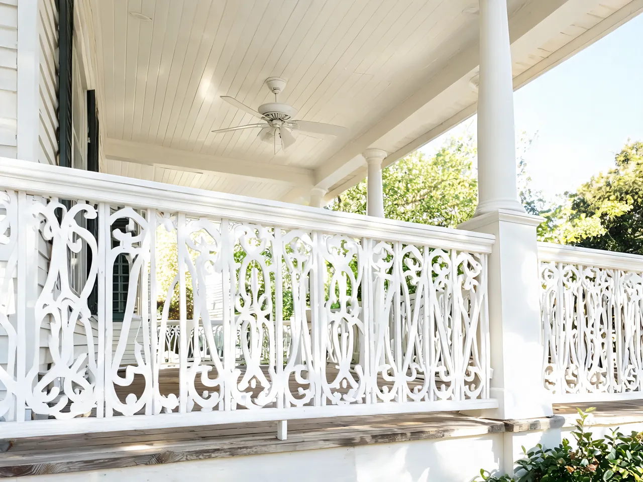 White chippendale pattern porch railing idea on a southern style front porch