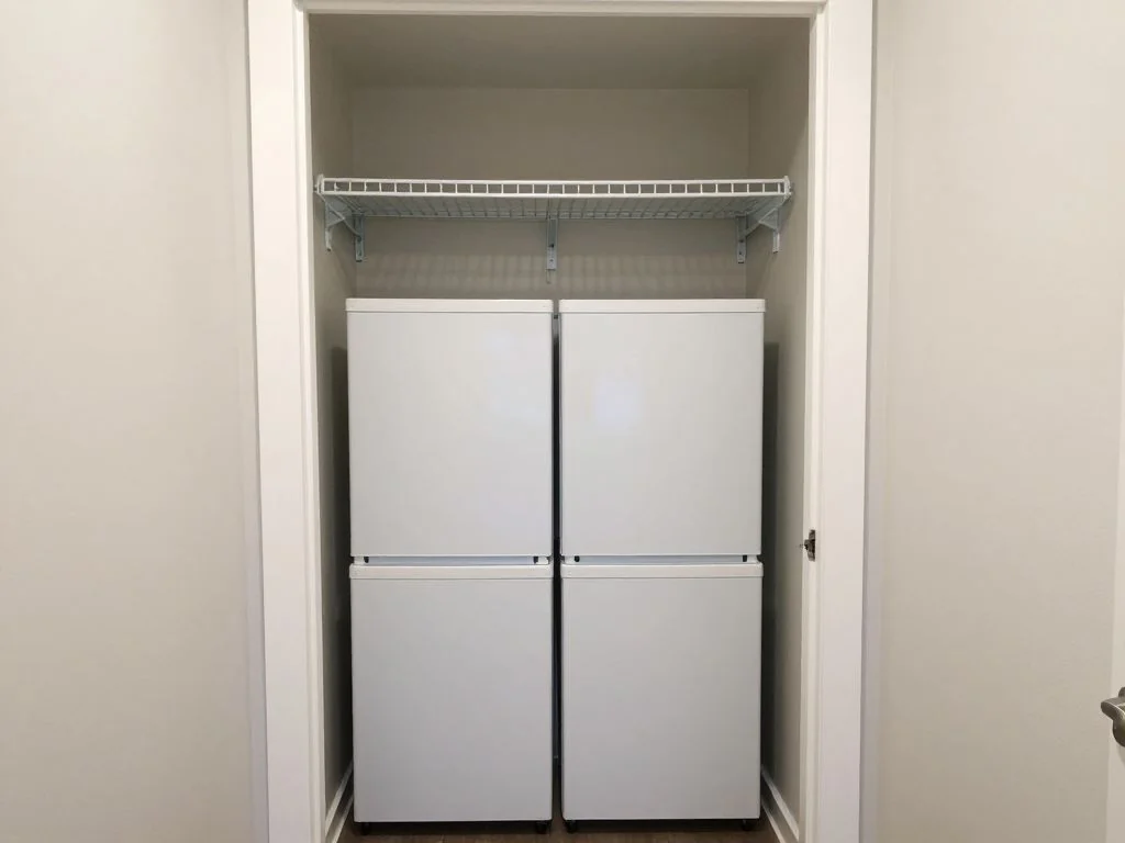 Small laundry upgraded with stacked units, a sink, and a pull-out hamper. before AI redesign