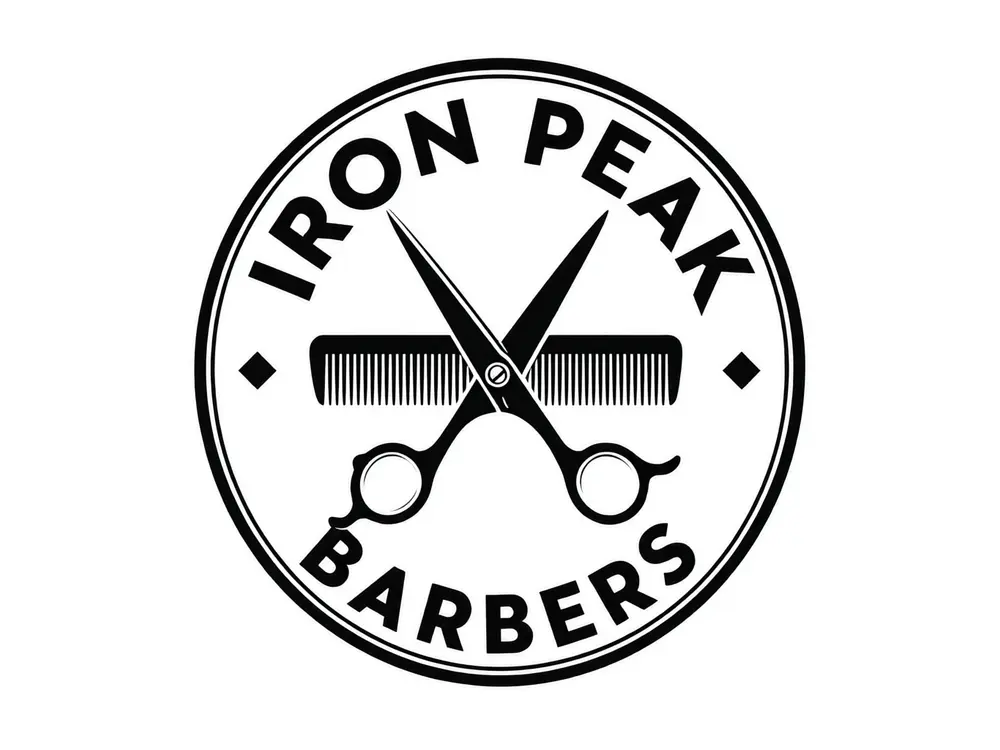 AI badge logo for Iron Peak Barbers with crossed scissors and a comb after AI redesign