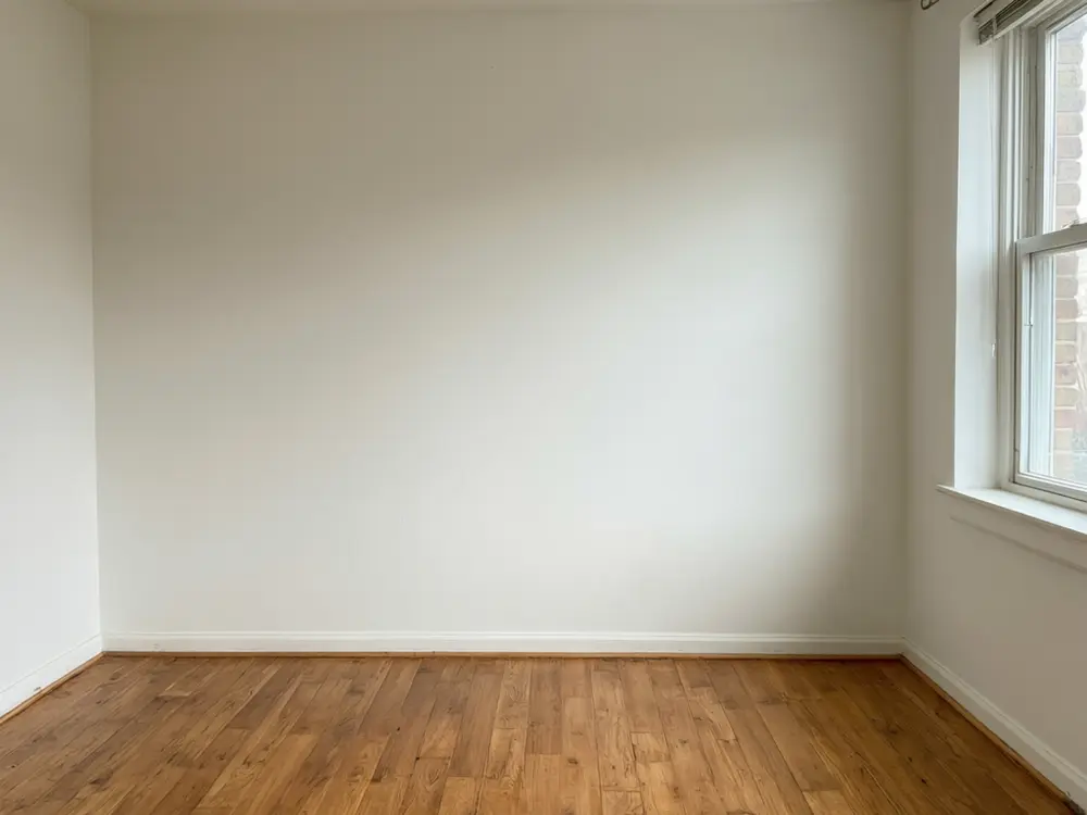 Closet visualizer result: a reach-in closet with white shelving, double rods and storage bins before AI redesign