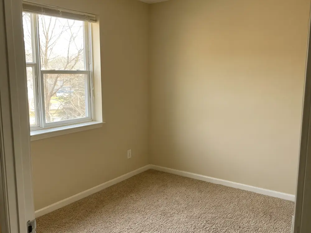 Closet visualizer result: a floor-to-ceiling wardrobe wall with white shaker doors before AI redesign