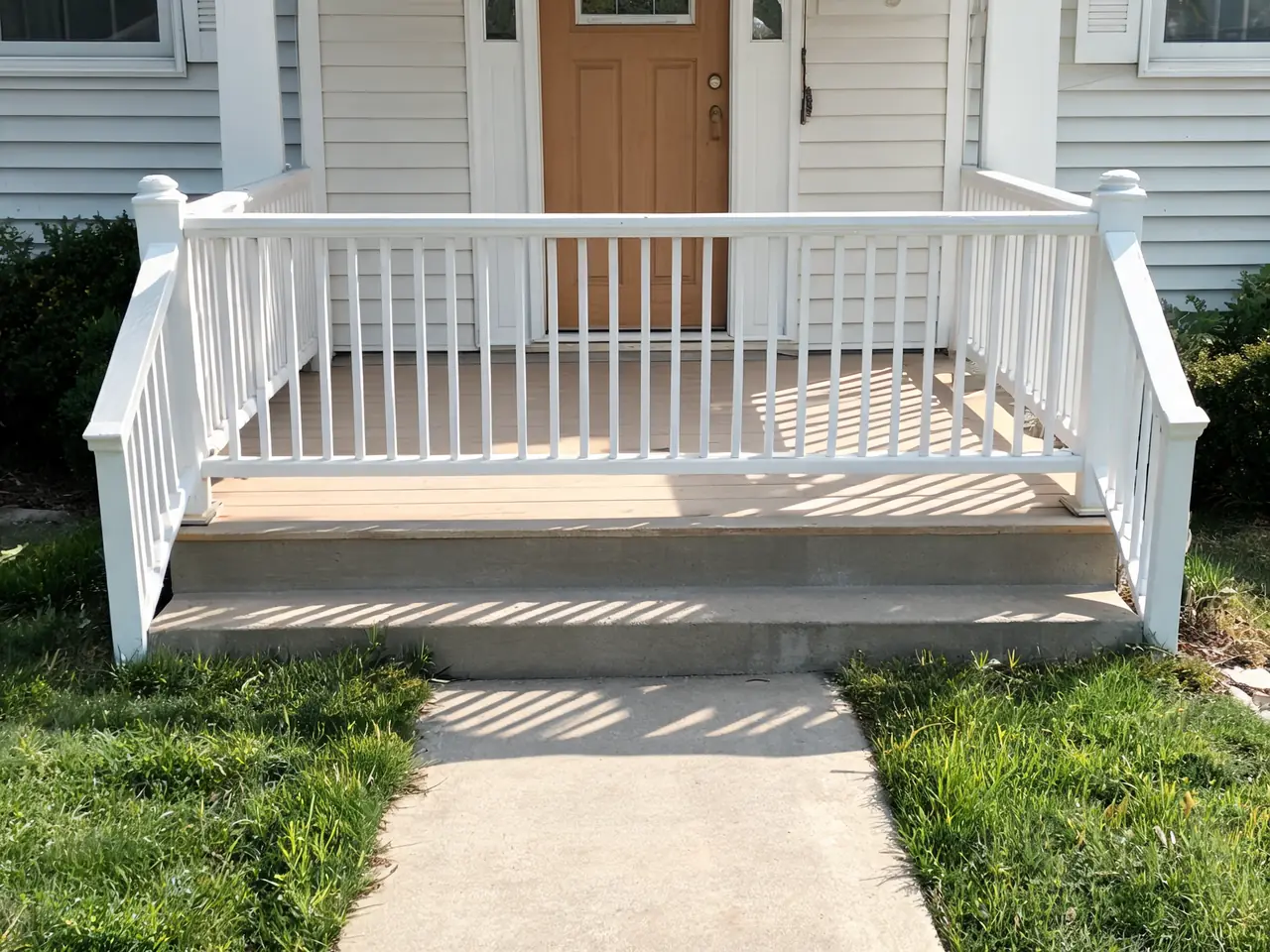 Porch railing visualizer result: dated white spindle porch railing replaced with slim black metal balusters before AI redesign
