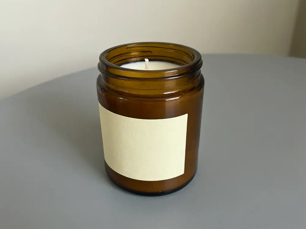 Etsy listing photo result: handmade candle in a sunny window lifestyle scene before AI redesign