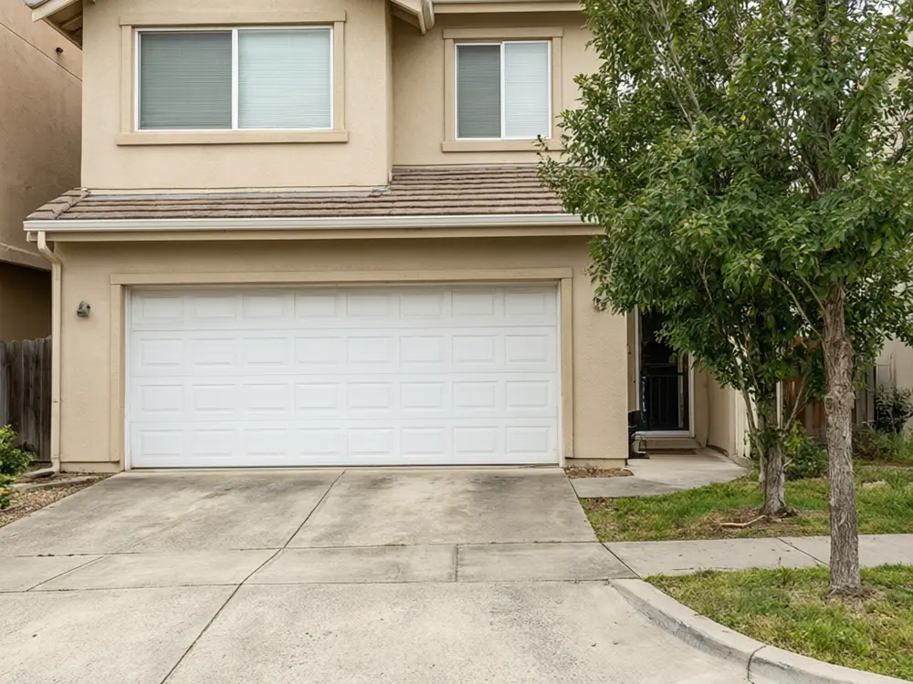 Garage door visualizer result: a black carriage house style garage door before AI redesign