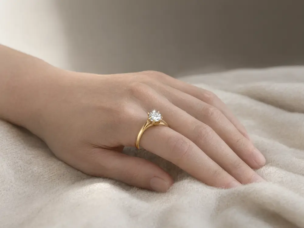 Jewelry photo result: gold ring worn on a hand after AI redesign