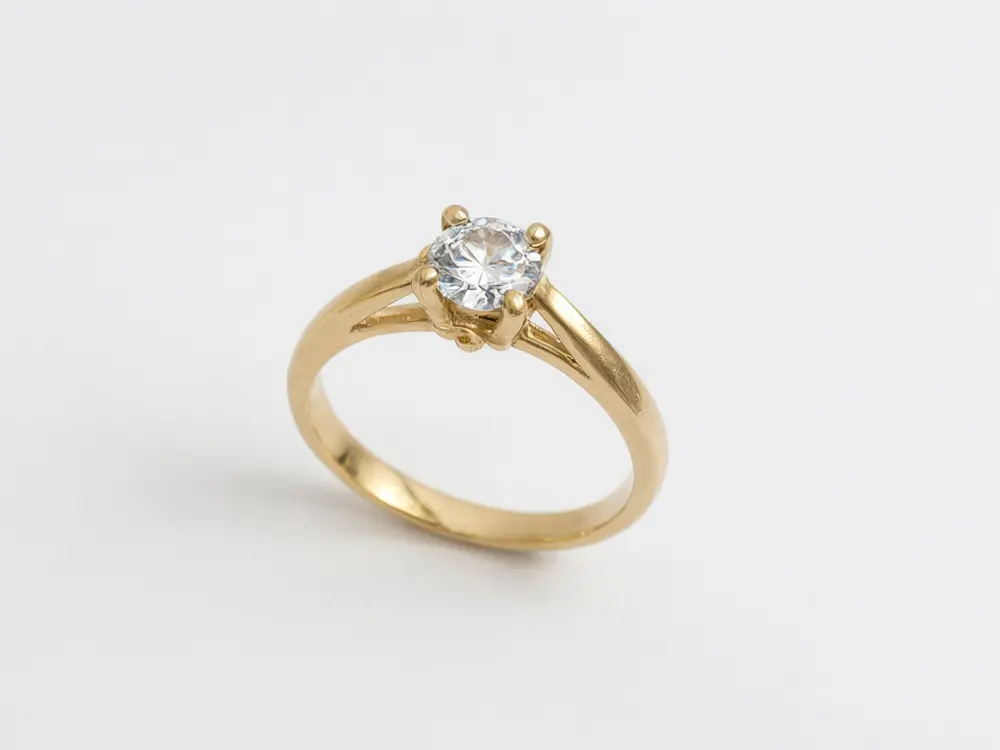 Jewelry photo result: gold ring worn on a hand before AI redesign