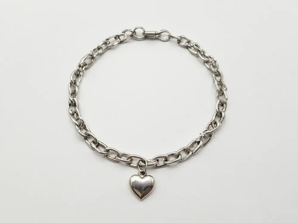 Jewelry photo result: bracelet worn on a wrist before AI redesign