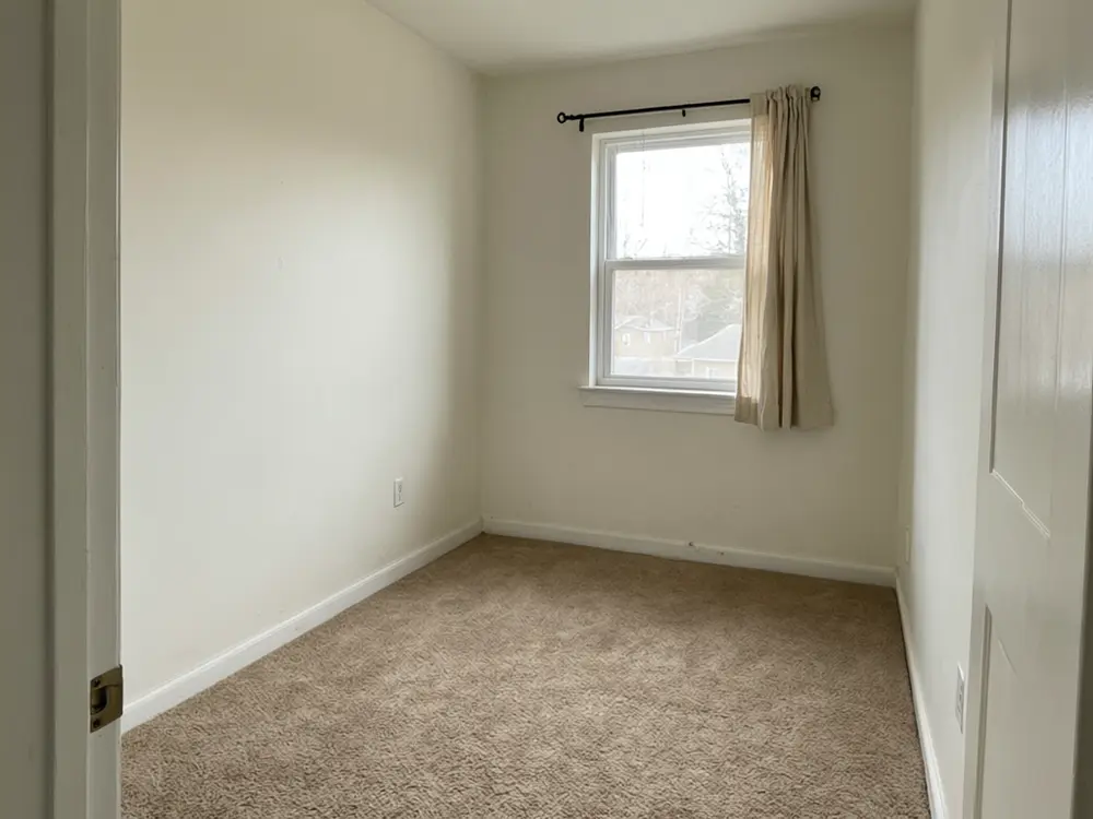 Kids bedroom visualizer result: a soft neutral toddler room with a low bed and play corner before AI redesign