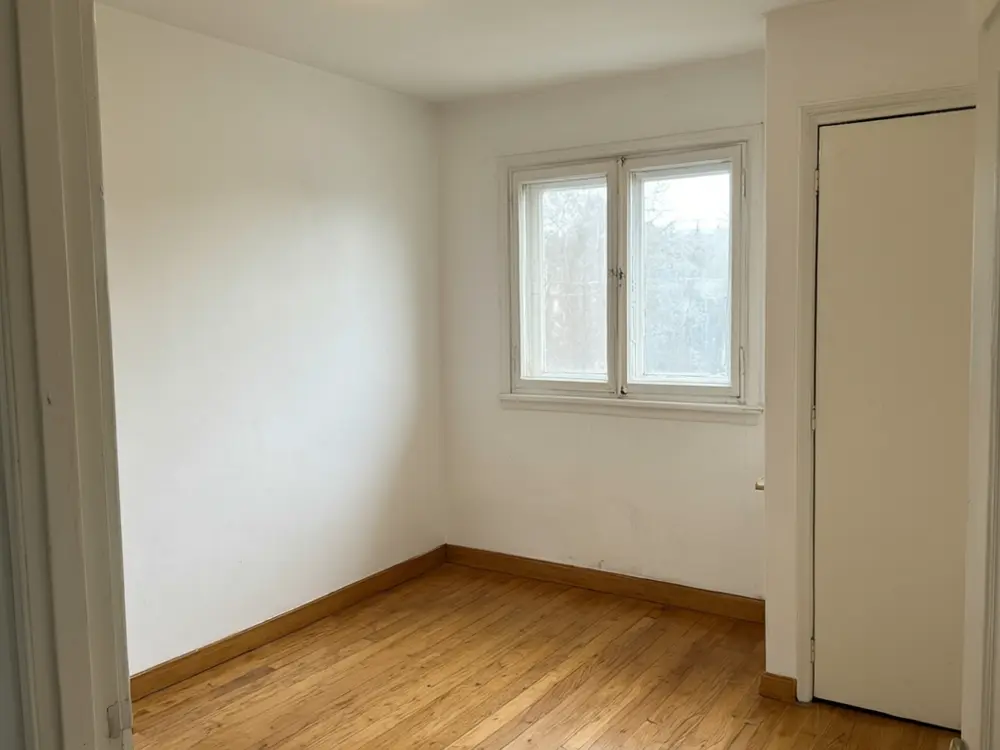 Kids bedroom visualizer result: a calm blue and white kids bedroom with a bed, desk and shelves before AI redesign