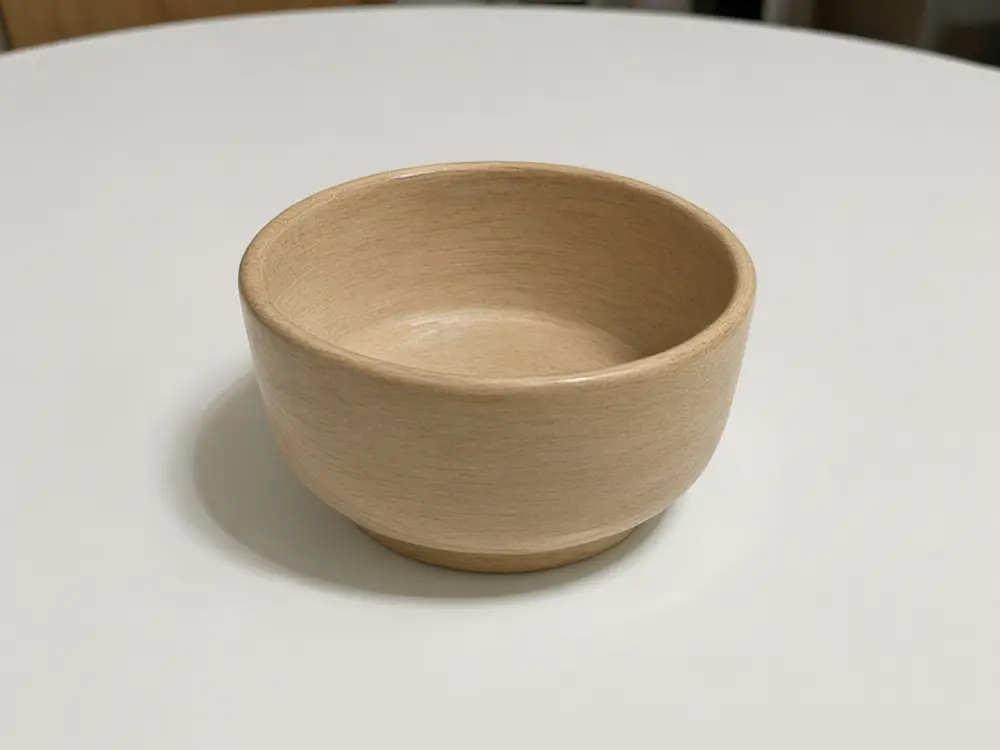 Product material variant result: ceramic bowl changed to light wood after AI redesign