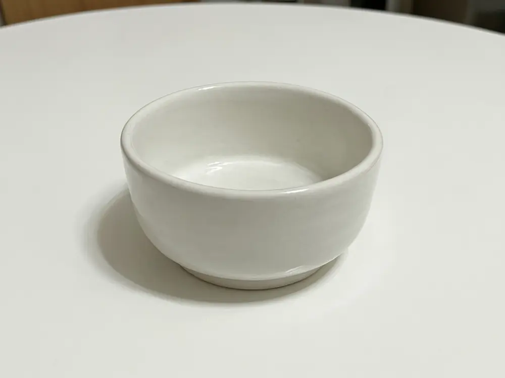 Product material variant result: ceramic bowl changed to light wood before AI redesign